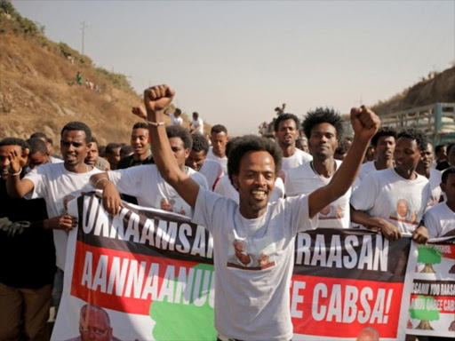 Supporters celebrate during the welcome fete for Merera Gudina, leader of the Oromo Federalist Congress party after his release from prison in Addis Ababa, Ethiopia, January 17, 2018. /REUTERS