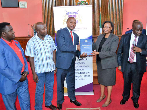 Embu Speaker Josiah Thiriku receives the Corruption Risk Assessment Report from EACC Commissioner Rose Mghoi