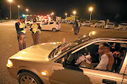 Traffic officers go through their routine  checks on the N1 at Carousel in  Hammanskraal, north of Pretoria. 