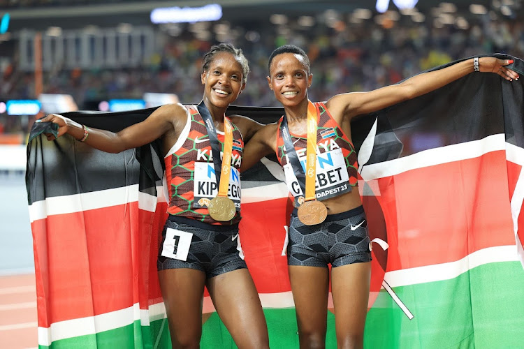 Faith Kipyegon and Beatrice Chebet after winning gold and bronze in the 5,000m at the 2023 World Athletics Championships in Budapest, Hungary