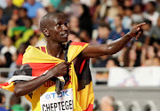 Uganda's Joshua Cheptegei celebrates winning gold. at the World Athletics Championships in Doha in October 2019. 