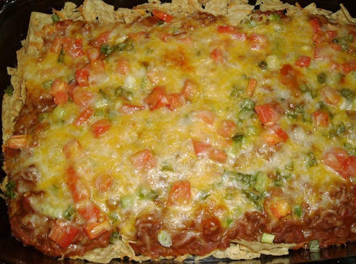 Full taco casserole recipe with tomatoes, cheese, beans and more