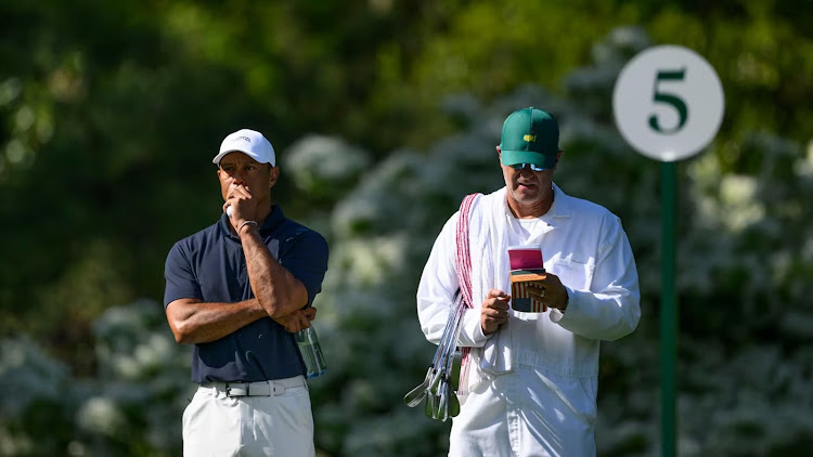 Tiger Woods gets in early work and “walked freely” at Augusta on Sunday.