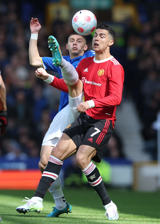 Manchester United's Cristiano Ronaldo in action with Everton's Vitaliy Mykolenko