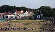 This file photo taken on July 20, 2013 shows US golfer Tiger Woods and England's Lee Westwood walking toward the green on the 18th during the third round of the 2013 British Open Golf Championship at Muirfield golf course at Gullane in Scotland. Muirfield golf club has voted to admit women as members for the first time in its history on March 14, 2017. Members at the privately-owned club voted 80.2% in favour of updating their membership policy.