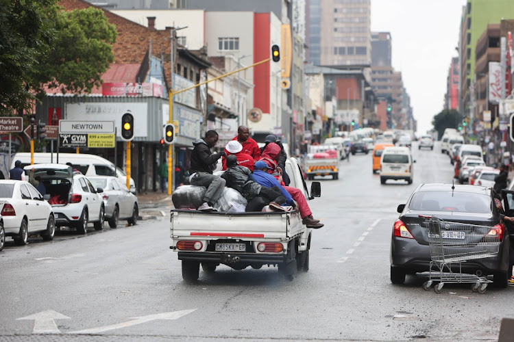 Daily life continues in Johannesburg during rainy weather.