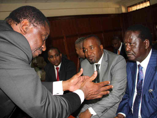 Siaya senator James Orengo consults with Opposition leader Raila Odinga. FILE