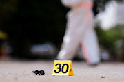 A view shows a shrapnel marked as a specimen near the scene of a blast in Kampala, Uganda, November 16, 2021.