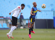 Fagrie Lakay of Cape Town City, right, challenged by Happy Jele of Orlando Pirates during a league match between the two sides.