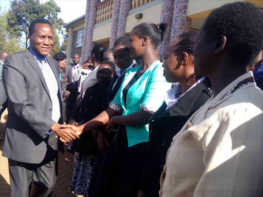 Lands CS Jacob Kaimenyi arrives at the Lands offices in Eldoret town yesterday / MATHEWS NDANYI