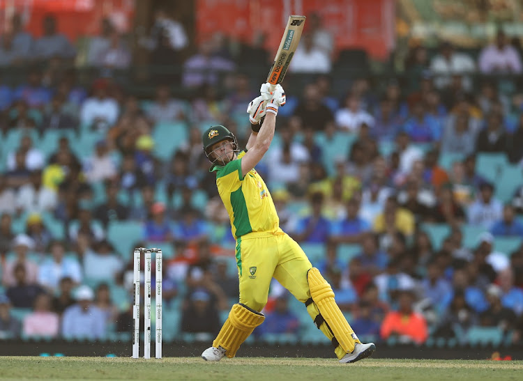 Australian Steve Smith plunders runs during his century in the opening one-day cricket international against India in Sydney on Friday