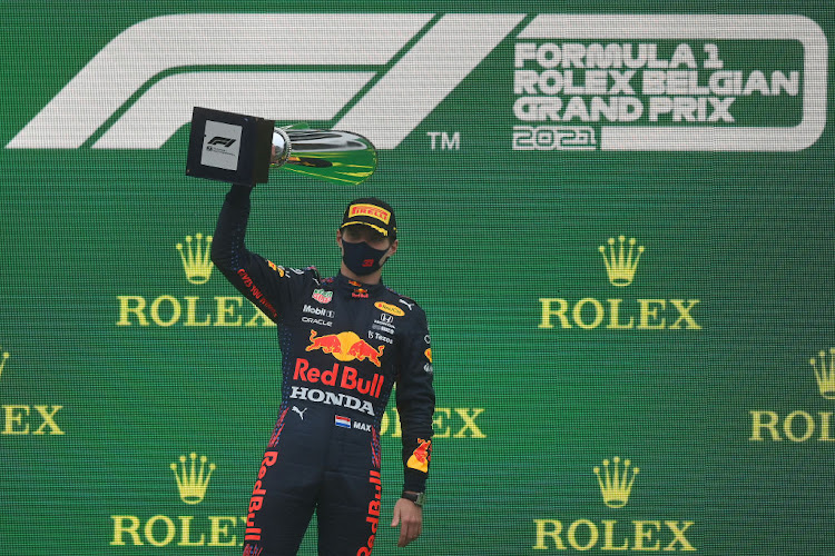 Race winner Max Verstappen celebrates on the podium during the F1 Grand Prix of Belgium at Circuit de Spa-Francorchamps on August 29, 2021 in Spa, Belgium.