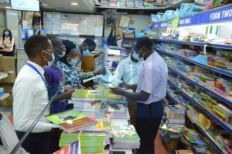 Parents buying textbooks and school materials, as schools resumes for third term at Savannah Textbook Center, Nairobi on January 3, 2022.