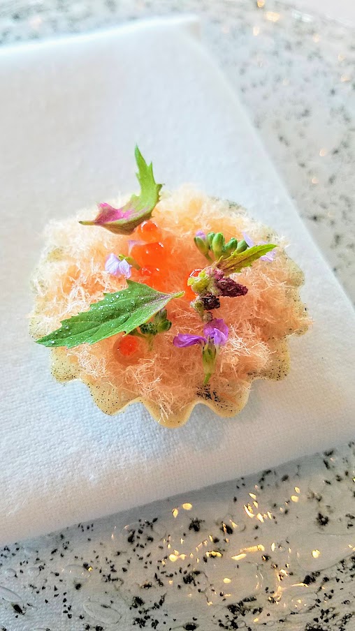 Course of Dried and Creamy Trout and Juice from Fermented and Grilled Cauliflower at Geranium, a three Michelin star restaurant in Copenhagen