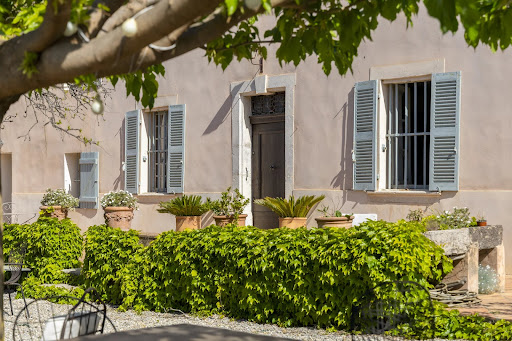 House facade with blue shutters in this luxury property for sale in Sanary-sur-Mer ($3,577,859)