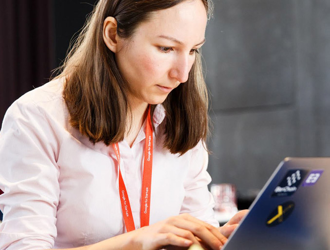 A lady busy on her laptop