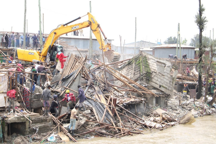 A bulldozer brings down several structures at Mkuru kwa Reuben on May 6, 2024/LEAH MUKANGAI