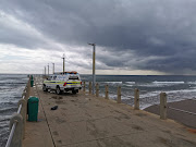 Swimming has been banned at some Durban beaches after heavy rain which turned the water murky and increased the chance of shark attacks.