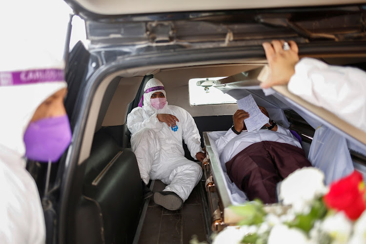 Carlos Mayorga, Mexican candidate for federal representative of the Solidarity Encounter Party, lies in a coffin as part of his campaign slogan ‘If I don’t deliver, let them bury me alive’ in Ciudad Juarez.