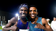 Ryan Mphahlele, left, and Tshepo Tshite celebrate their 1,500m personal bests at the Green Point stadium in Cape Town last year. 