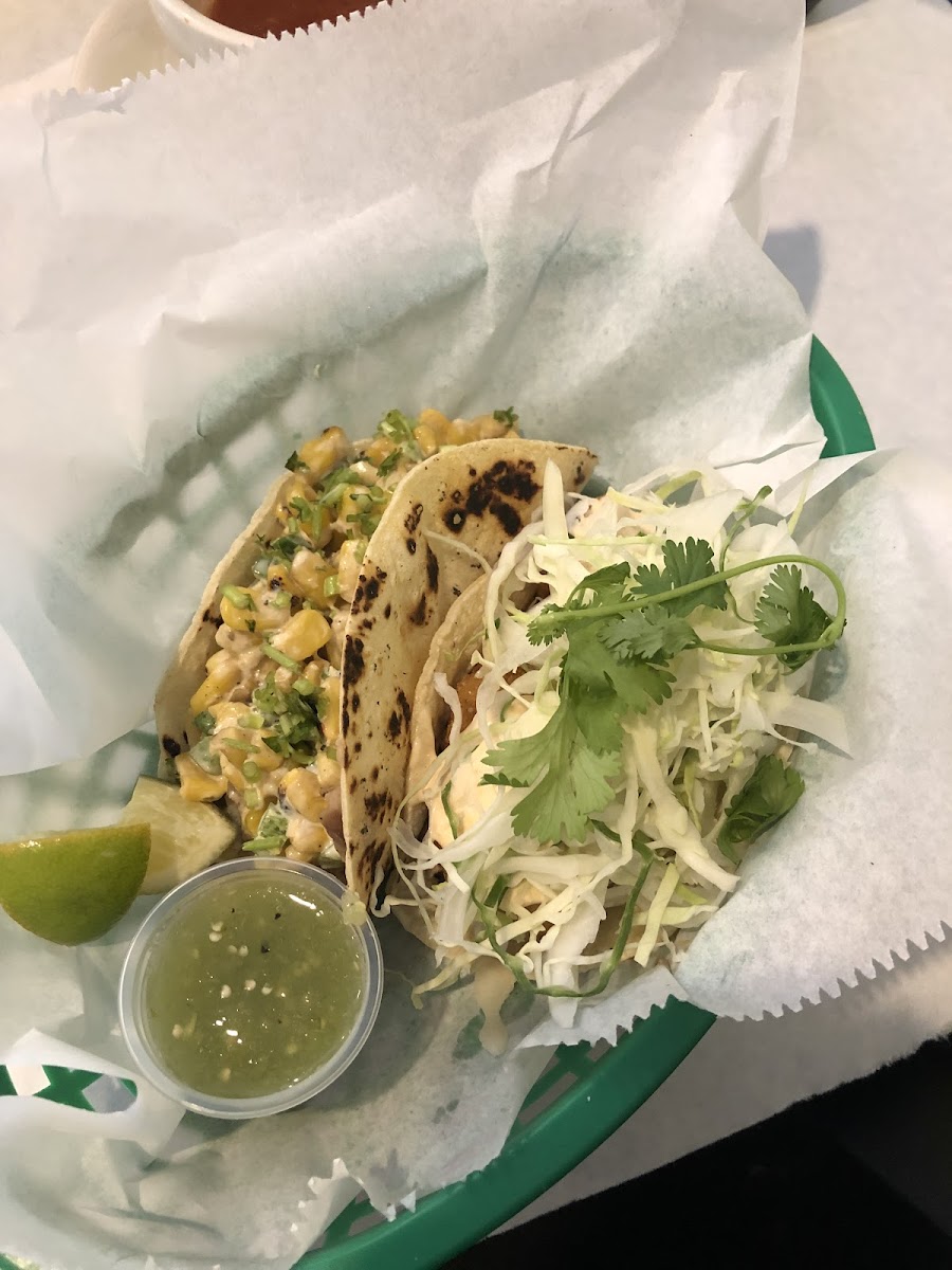 Veggie taco on the left and fried catfish taco on the right