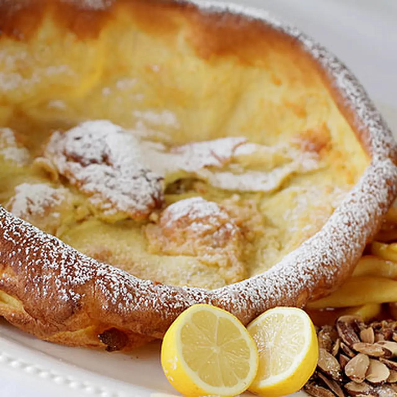 Dutch Baby Pancake with Lemon and Powdered Sugar - AngelaLynne