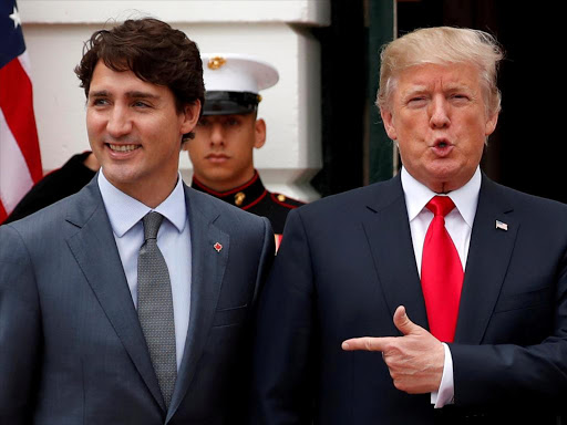 US President Donald Trump welcomes Canada's Prime Minister Justin Trudeau on the South Lawn before their meeting about the NAFTA trade agreement at the White House in Washington, US October 11, 2017. /REUTERS