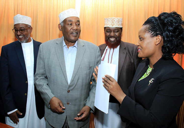 National Muslim Leaders Forum chairman Abdullahi Abdi, Supkem chairman Yusuf Nzibo with Namlef deputy chairman Al-Hajj Yussuf Murigu with National Assembly director for legal affairs Van Akama at Parliament Buildings yesterday