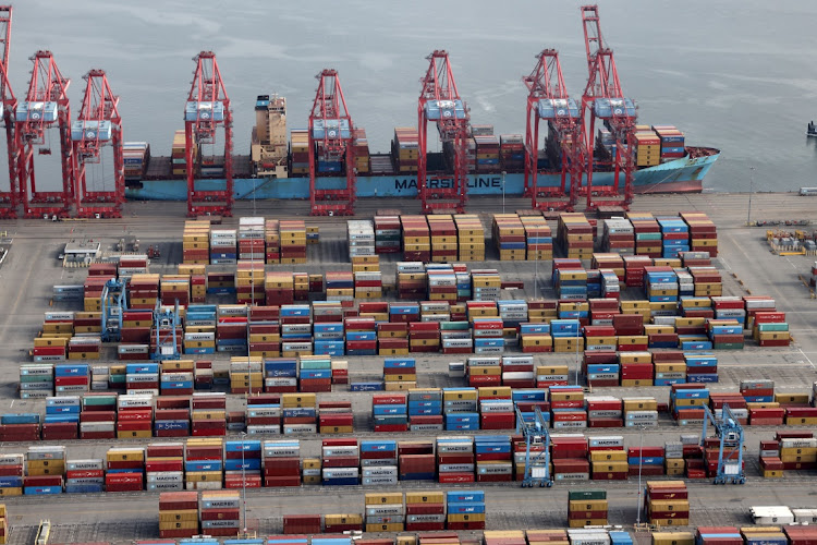 Shipping containers are unloaded from a ship at a container terminal at Los Angeles Port in California, the US. File photo: LUCY NICHOLSON