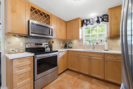 Kitchen with light wood cabinets - Buy this luxury house in Tampa, 3 bedrooms