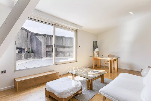 Living room with terrace and wooden furniture - Luxury apartment / penthouse for sale in Toulouse, 1 room