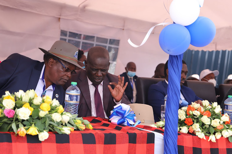 Imarisha Sacco chairman Mathew Ruto consult with Narok County CEC for Trade & Industrialization Ezekiel Rono during the launch of Narok Branch/HANDOUT