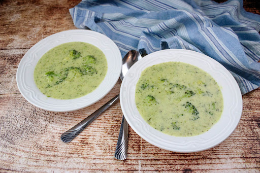 Two bowls of Creamy Broccoli Cheese Soup.