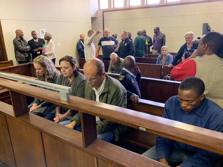 The four people accused of kidnapping Amy'Leigh de Jager appear in court on Friday. From left to right are Tharina Human, 27, Laetitia Nel, 40, Pieter van Zyl, 50, and Bafokeng Molemohi, 24.