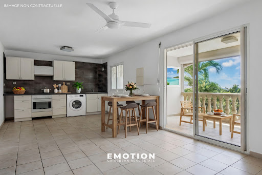 Open kitchen dining room balcony sea view - Prestige apartment for sale in Saint-Martin, 3 rooms, 2 bedrooms