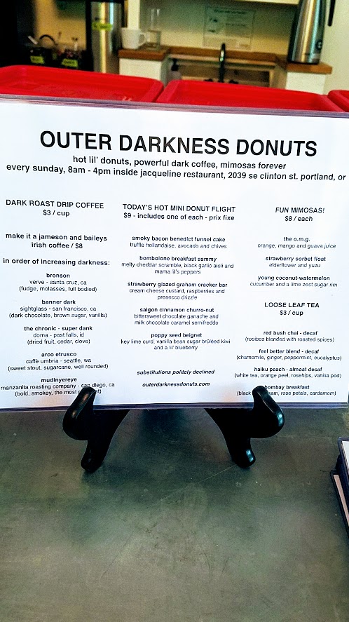 My first look at Outer Darkness Donuts, which on offer here only on Sundays are dark roast drip coffees, fun mimosas, loose leaf tea, and only one food dish you can order: a flight of mini-donuts.