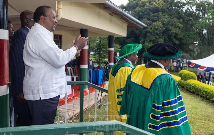 President Uhuru Kenyatta clapping after awarding charter at Kakamega State Lodge on August 2,2022.