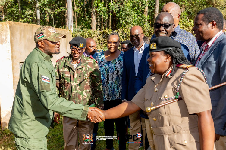 Public service CS Moses Kuria exchanging greetings with leaders in Nyamira county while on a tour of the NYS and Vocational Training Centres Mashinani programme on March 22, 2024.