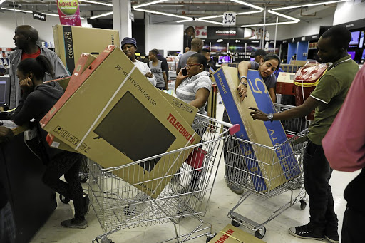 Shoppers buying big-ticket items at Black Friday sales could become targets for crime syndicates, experts warn.