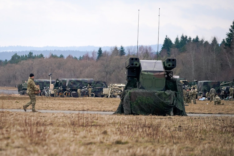 US Army soldiers assigned to the 82nd Airborne Division, deployed to Poland to reassure Nato allies and deter Russian aggression, encamp at an operating base 6km from the Ukrainian border, near Przemysl, Poland on February 21 2022. Picture: REUTERS/BRYAN WOOLSTON