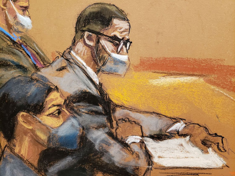 R. Kelly attends his sex abuse trial with his lawyers Nicole Blank Becker and Thomas Farinella at Brooklyn's Federal District Court in a courtroom sketch in New York, U.S., September 20, 2021.