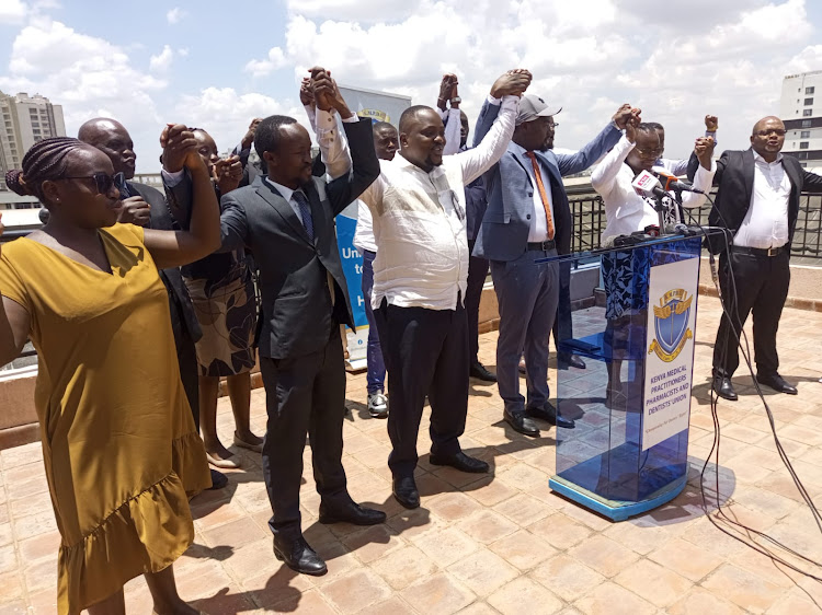 Doctors sing solidarity song after addressing the media at their offices on March 18, 2024. They have maintained the strike is still on until their demands are met