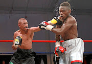 Thato Bonokwane, left,  will face  Samuel Esau from Western Cape in an eight-rounder in Kagiso on Saturday. Bonokwane is seen here pummeling  Bongani Bhuti in a previous bout. / Christo Smith