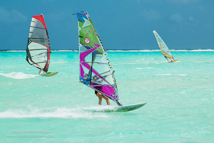 Windsurfers catch the breeze in a bay on Bonaire. 