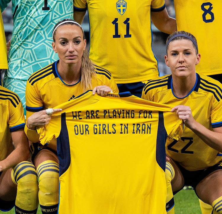 Sweden national women's team display a jersey in support of Iran women