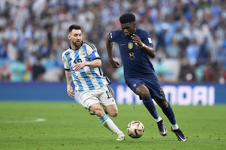 Aurelien Tchouameni of France is challenged by Lionel Messi of Argentina in the World Cup final at Lusail Stadium in Lusail City, Qatar on December 18 2022.