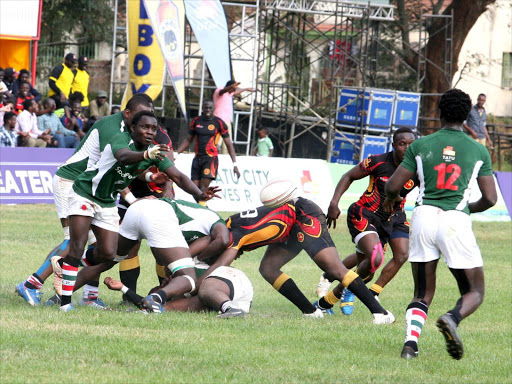 Simba Scrum half Edwin Achayo passes the ball to Nato Simiyu during their game against Uganda. /ENOS TECHE