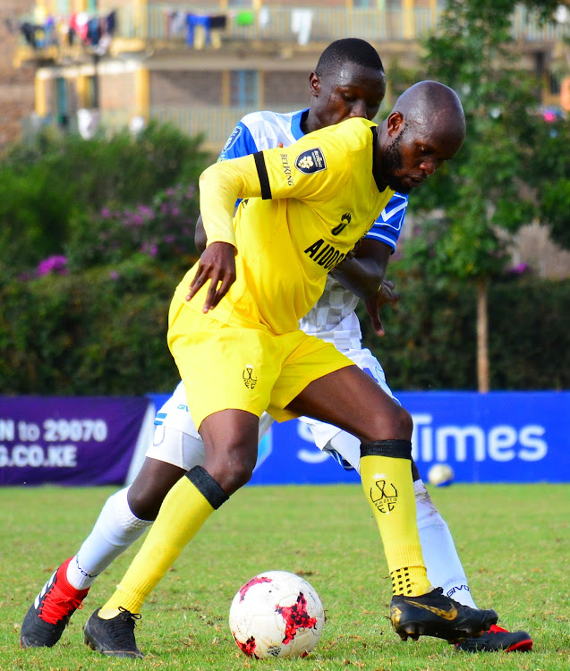 Wazito's Whyvonne Isuza shields the ball from David Kalama of Bidco during a Premier League match at Utalii Sports Club.