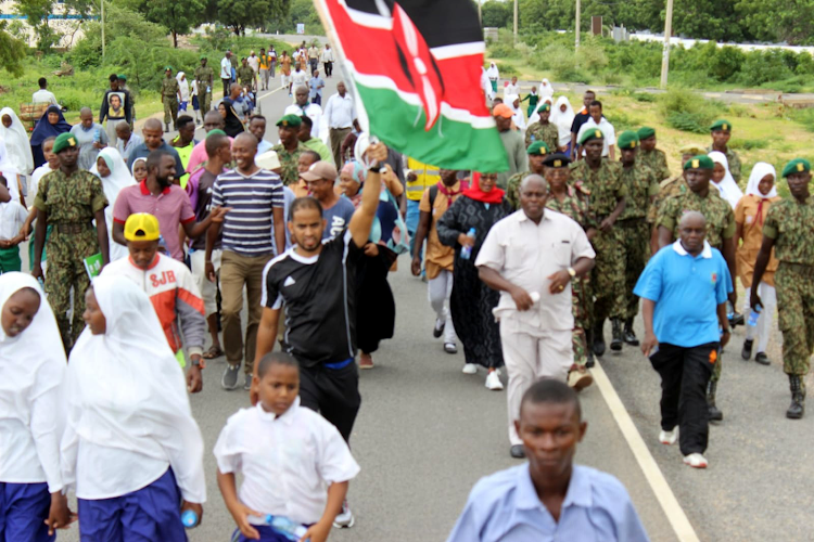 Lamu residents,politicians,students,peace activists and security officials take part in the peace run at Mokowe On Thursday.