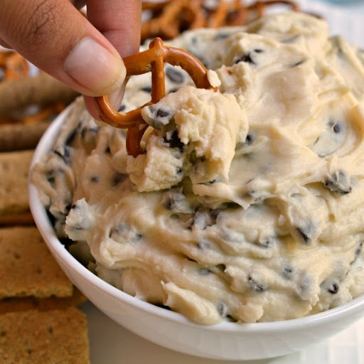 This delicious Cookie Dough Dip is a well loved dessert dip that is made in less than ten minutes.  Serve with pretzels, graham crackers and fresh strawberries for an over the top dessert.